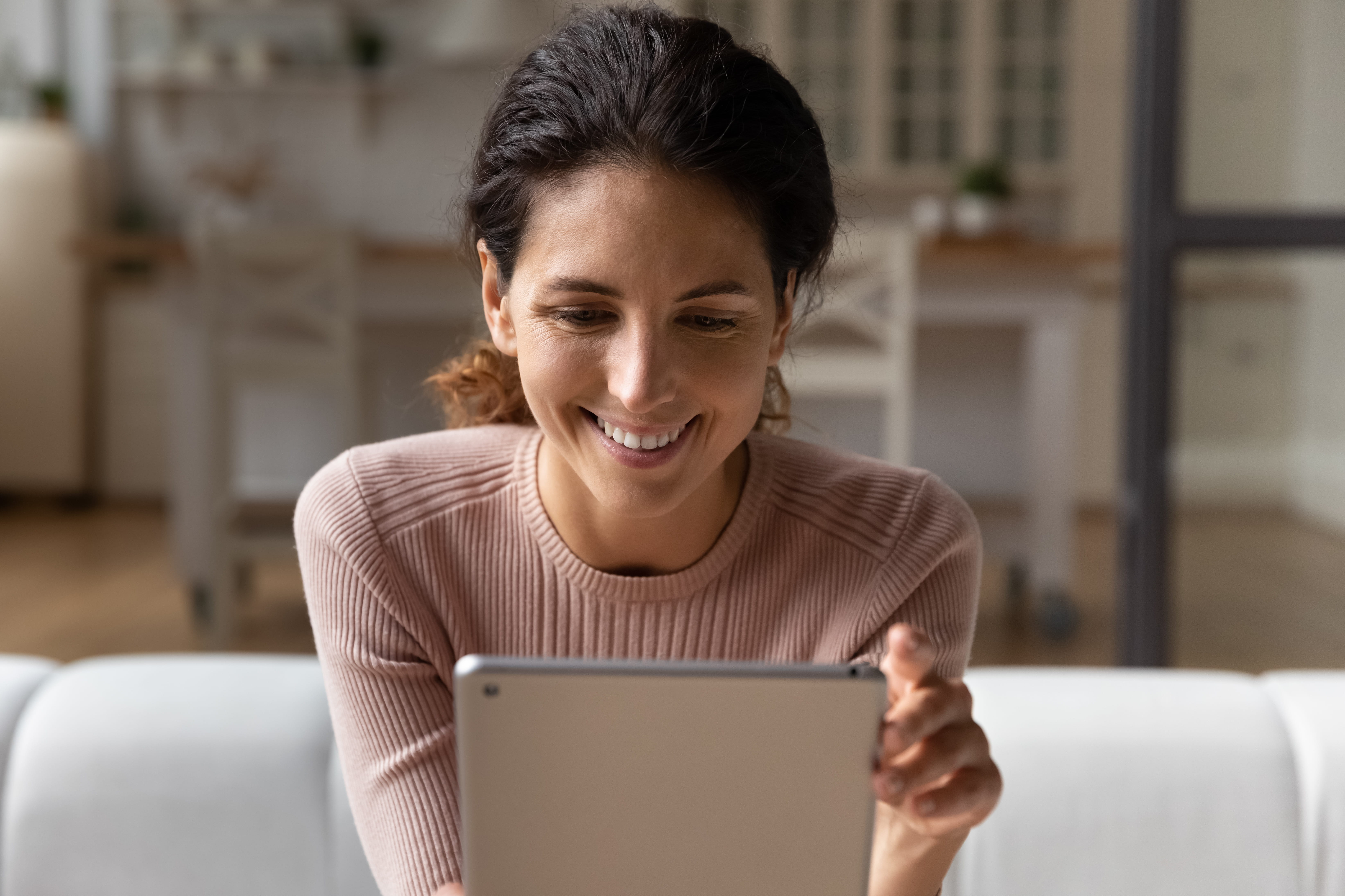 Diverse group of workers in an office. One is kneeling on floor, two are sitting in chairs, two are standing. Diverse group of workers in an office. One is kneeling on floor, two are sitting in chairs, two are standing.