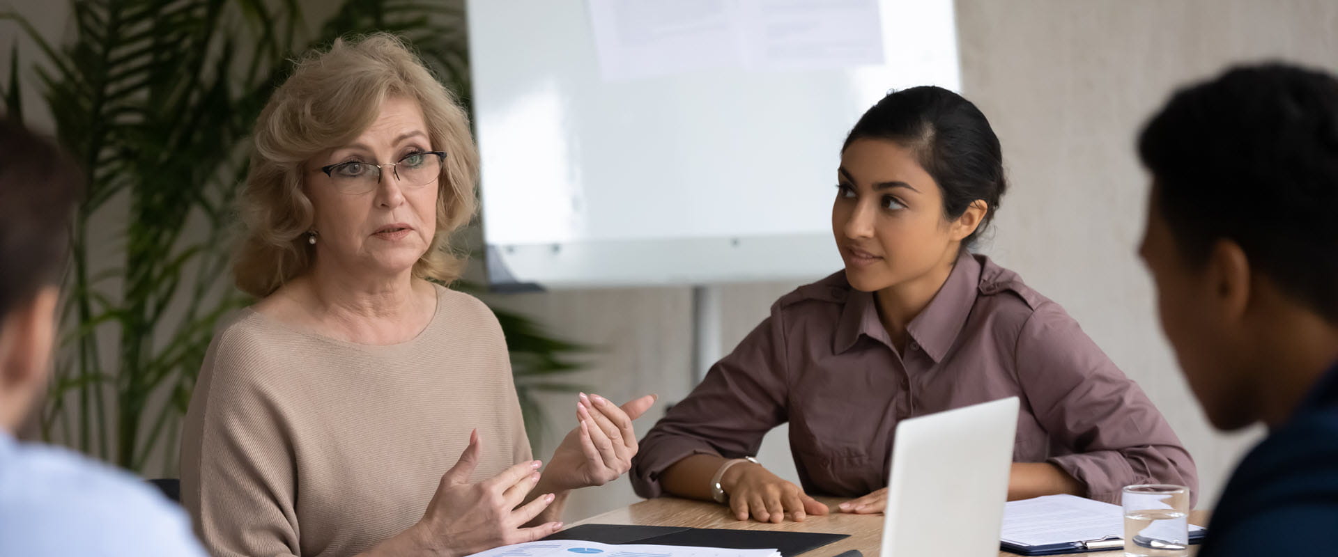 group of office workers listening