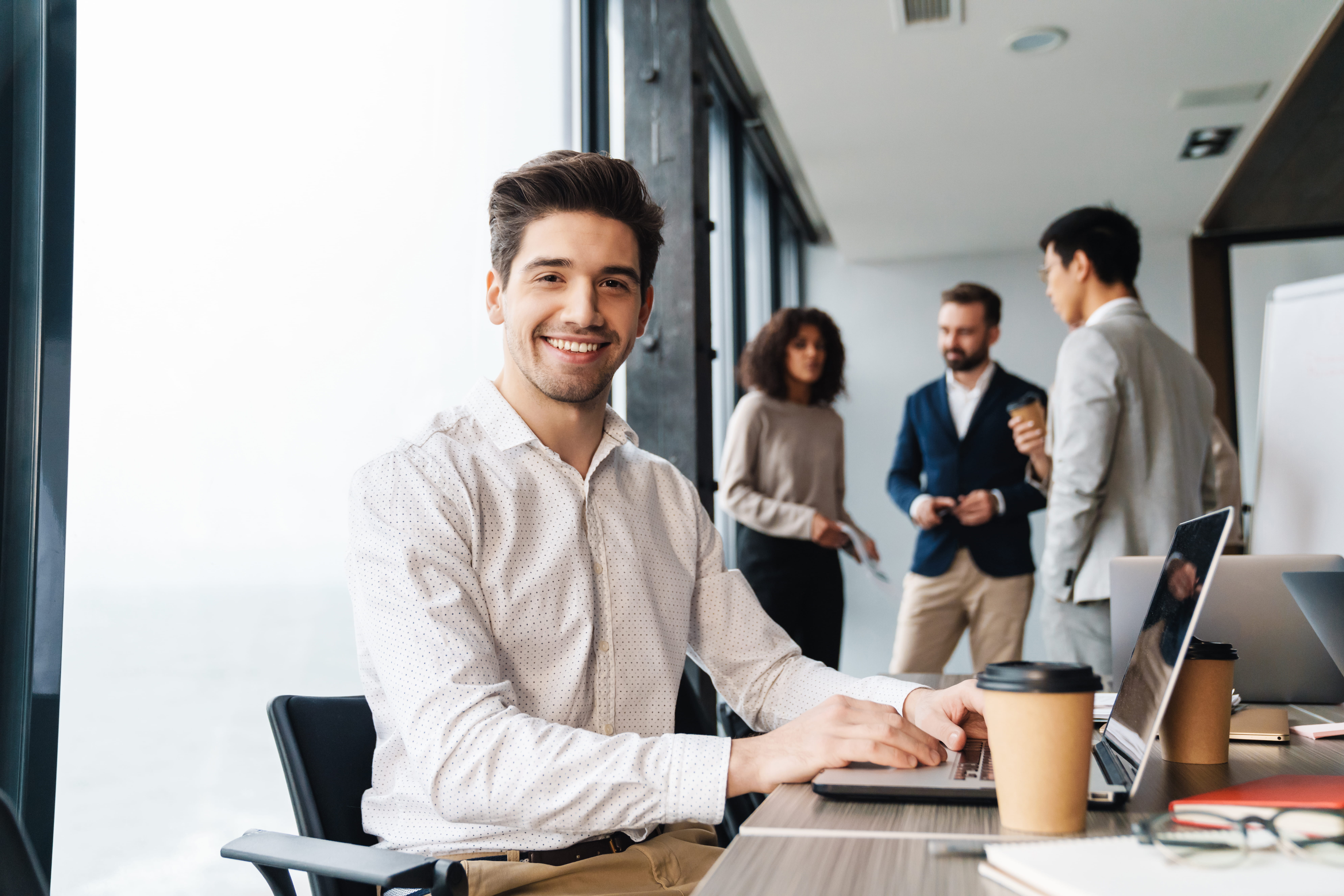smiling man working on laptop smiling man working on laptop