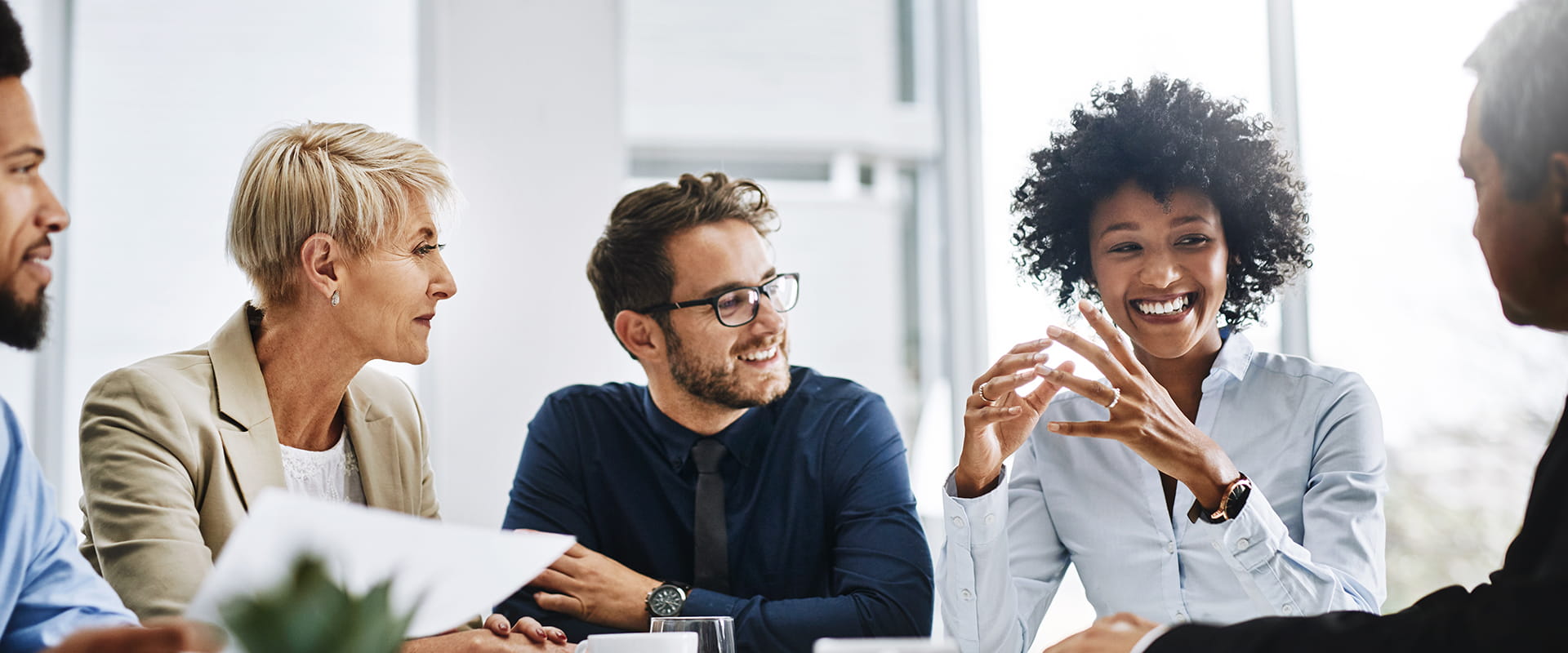 group of diverse colleagues having a conversation in a meeting