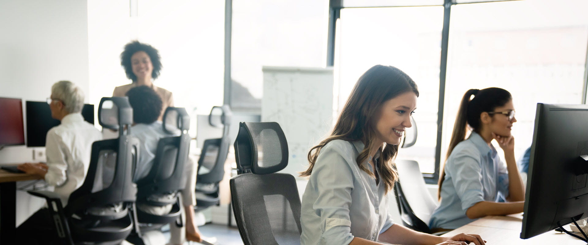group of employees working in office
