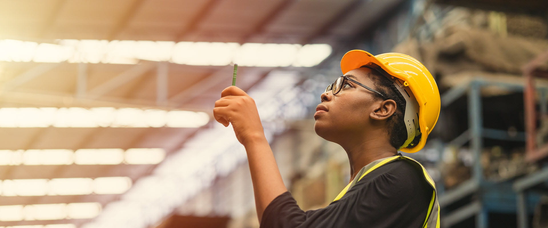 working in warehouse wearing hardhat