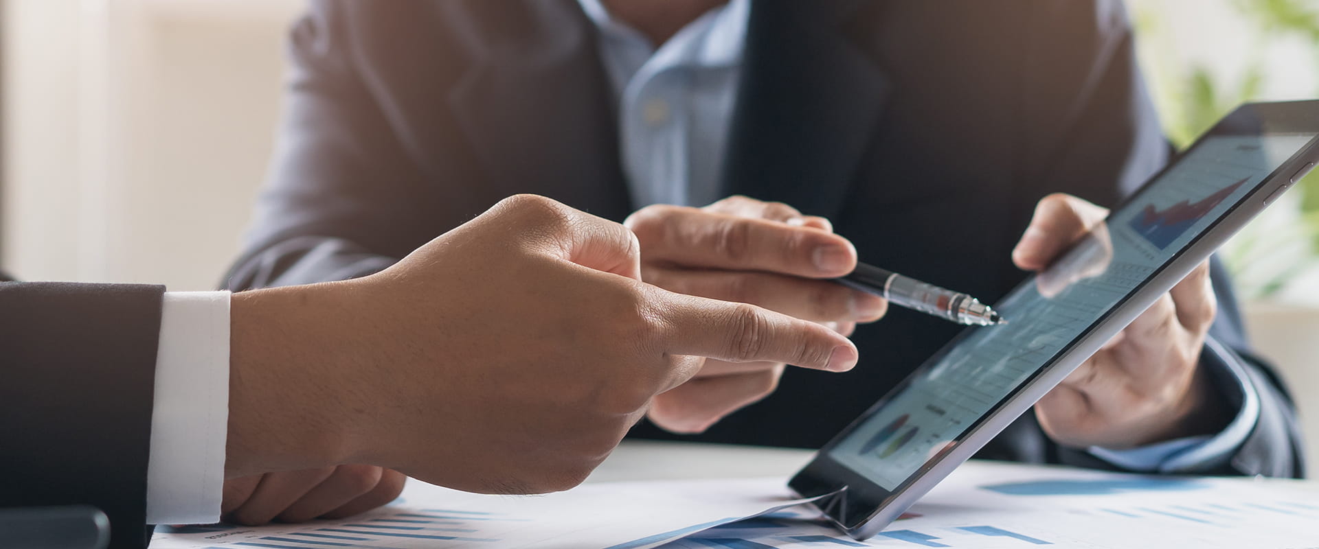 professionals holding ipad