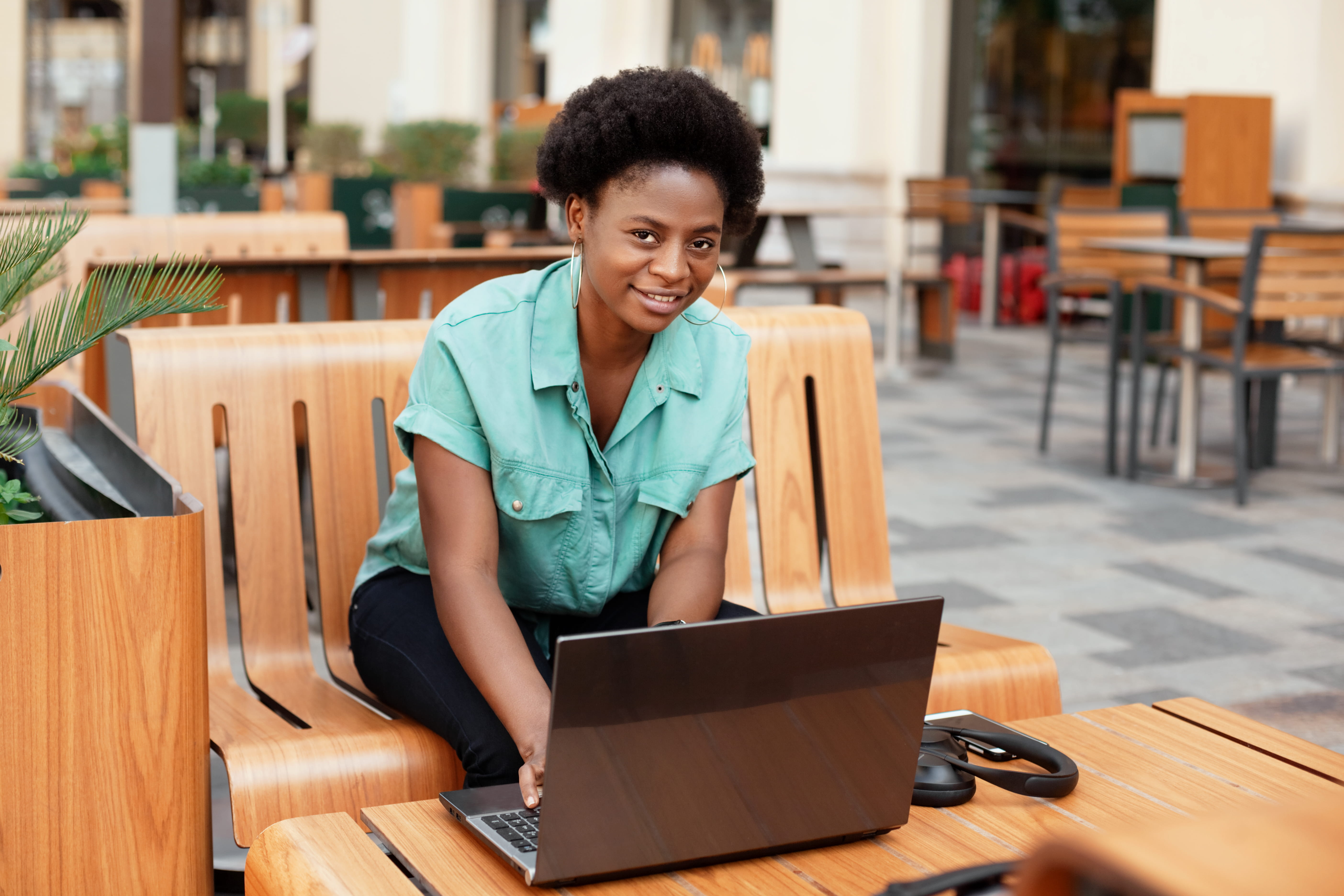 happy young woman working on laptop