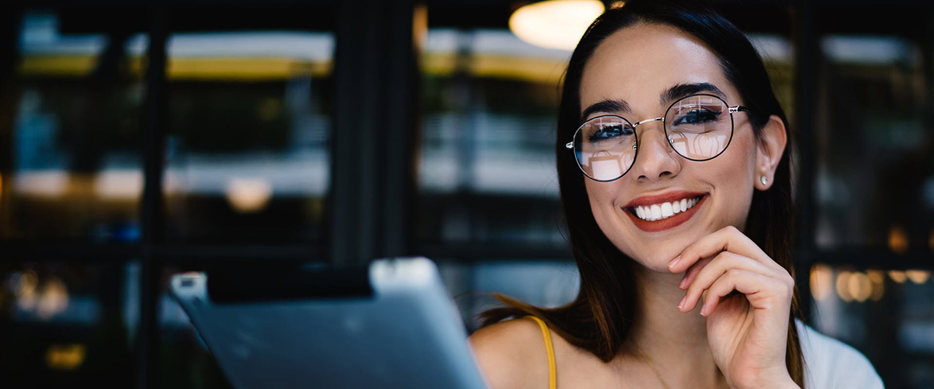 smiling woman using tablet