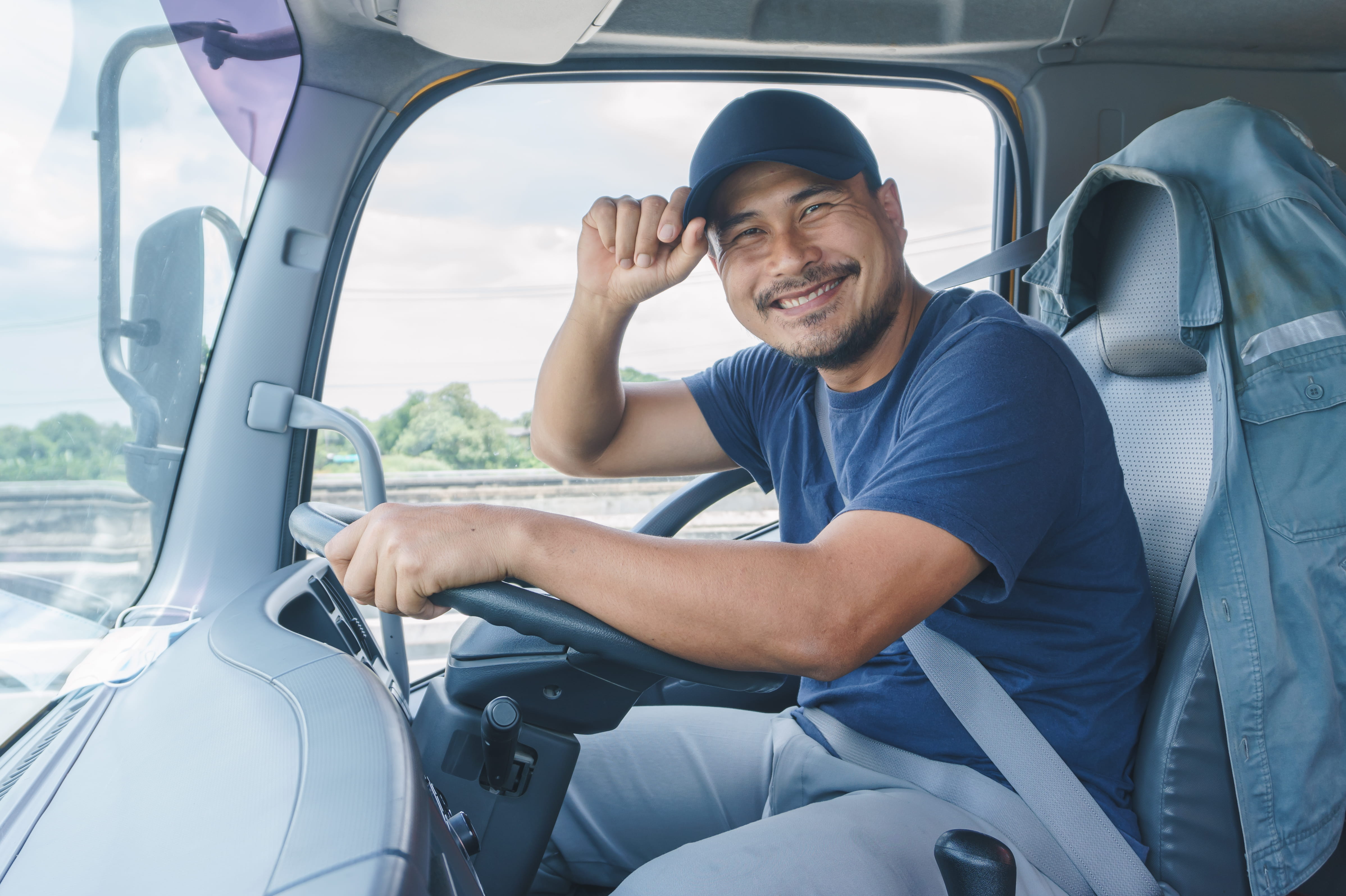driver sitting in cab of truck
