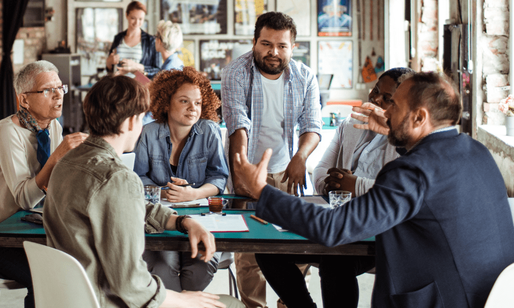 workers discussing in a meeting room
